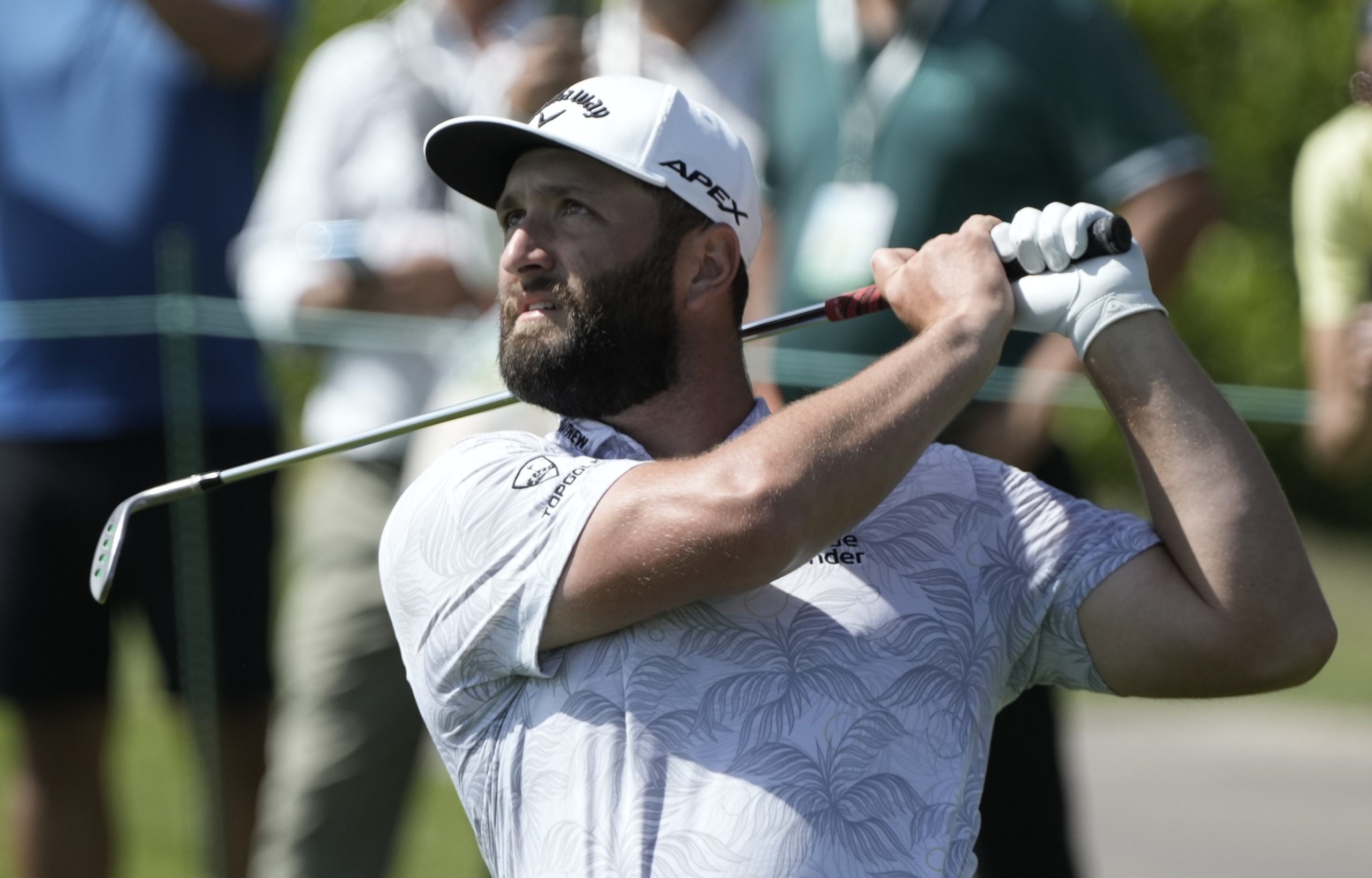 Jon Rahm shoots course record as title defence hots up